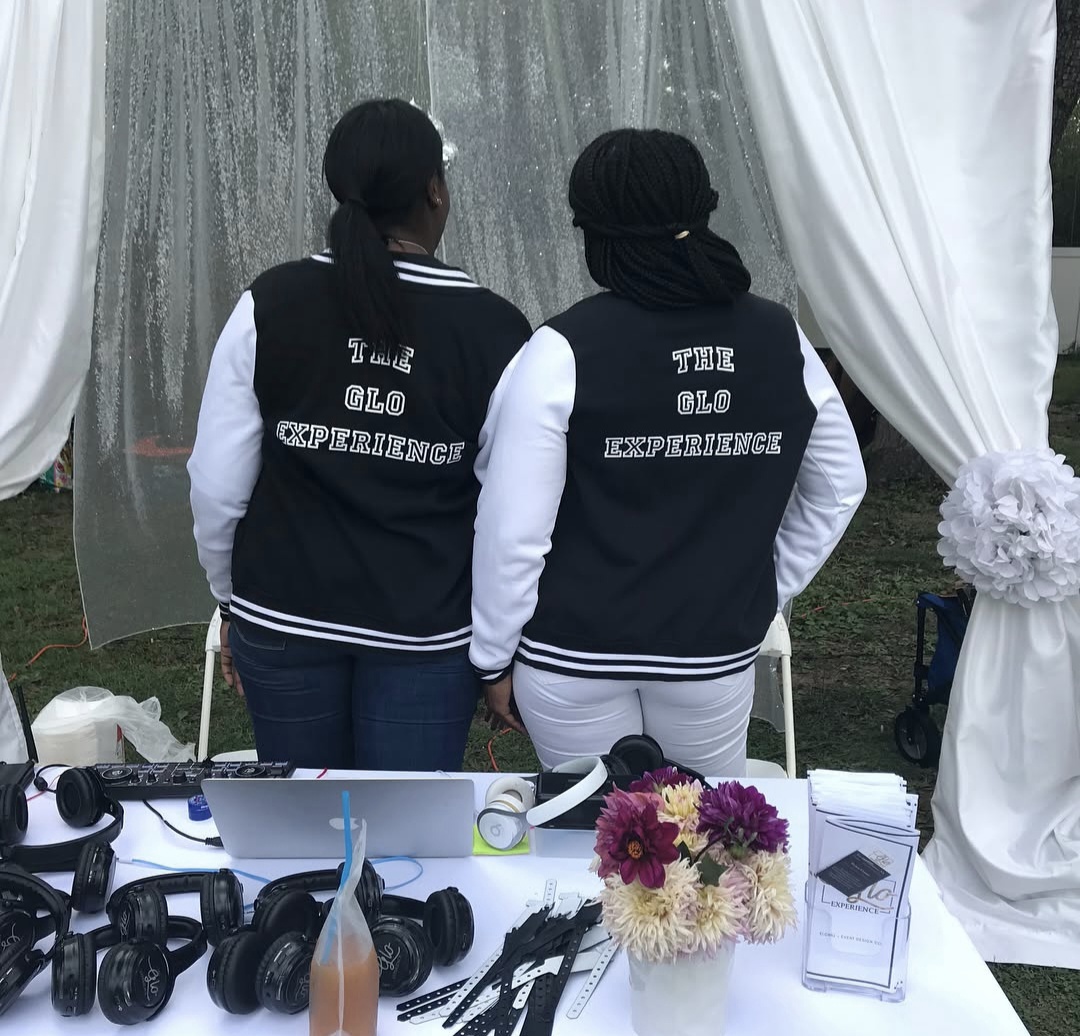 Gloria D. Cassell’s daughter operating music equipment at a Glo Experience event in 2018.